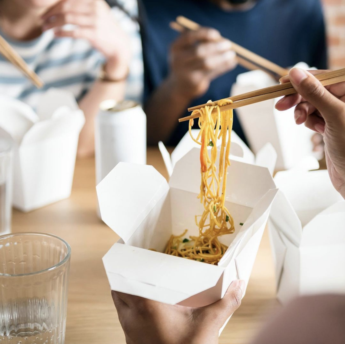 people eating with chopsticks