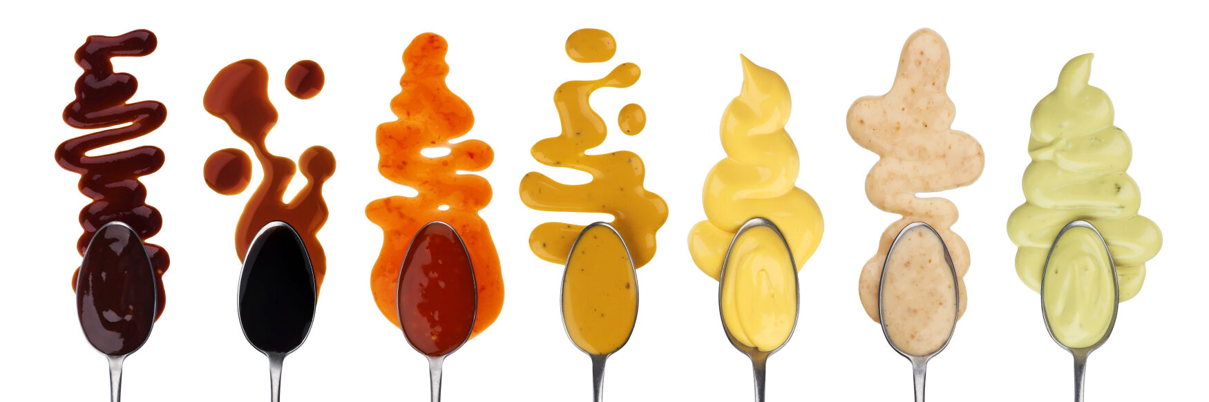 soy sauce, sriracha, and other sauces in spoons